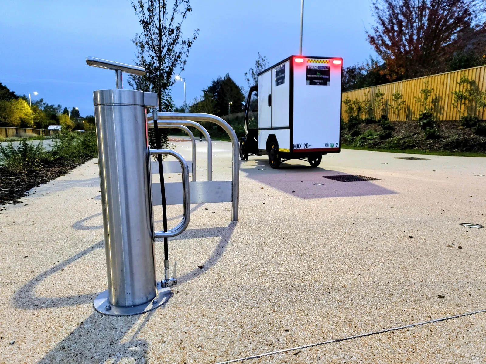 Rear view of a SendSimply electric cargo bike showing its enclosed cargo compartment
