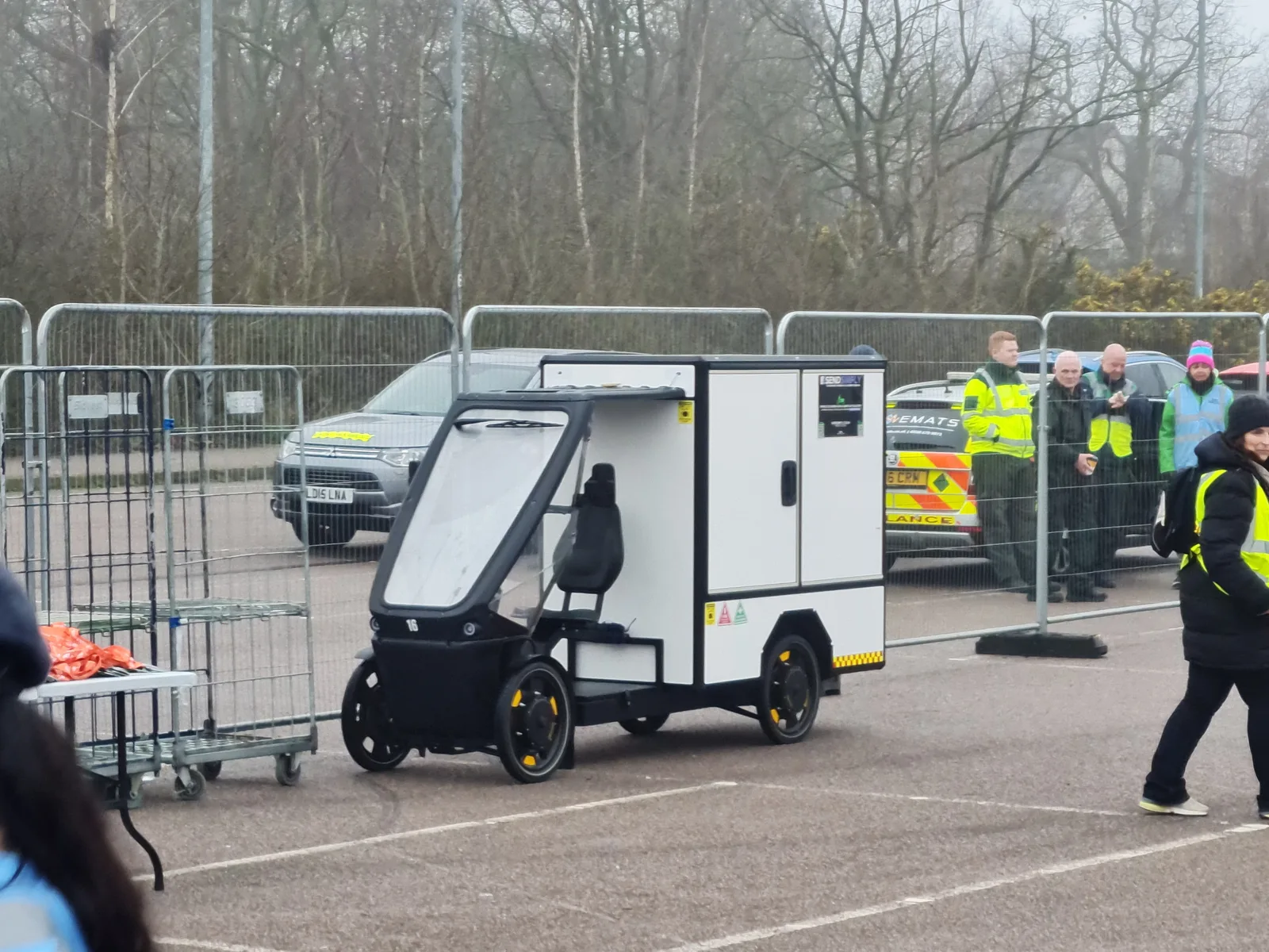 SendSimply electric cargo bike beside event barriers and stewards in Colchester