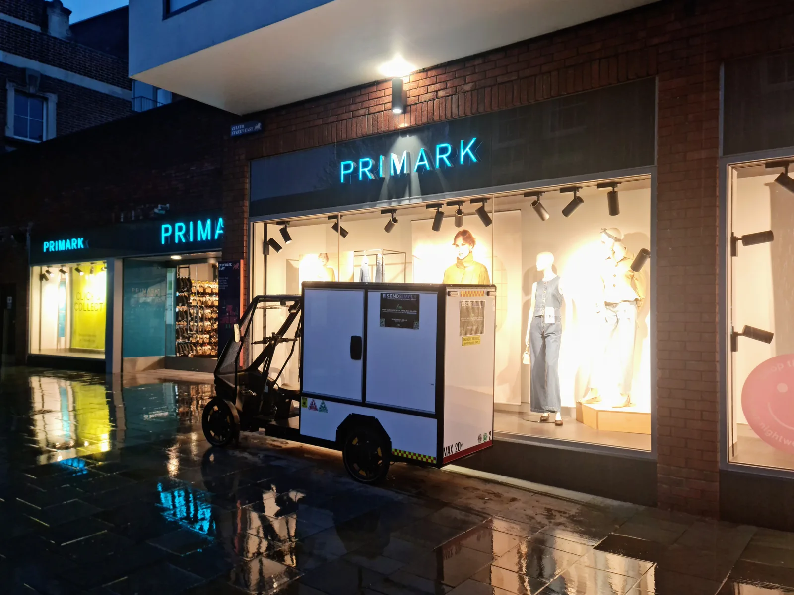 SendSimply electric cargo bike on a Colchester high street at dusk